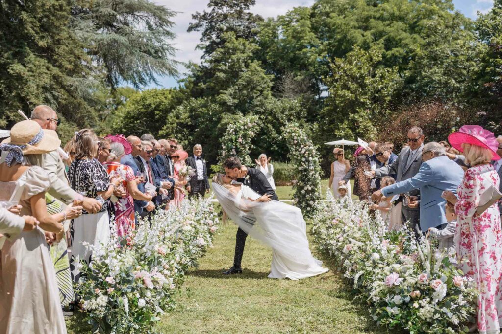 3-Bride-and-groom-say-I-do-in-the-wildflower-ceremony-at-wedding-venue-in-France-Chateau-de-la-Couronne-copy